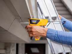 Close-up of LadderLatchPro being secured to the top of the ladder and roof 